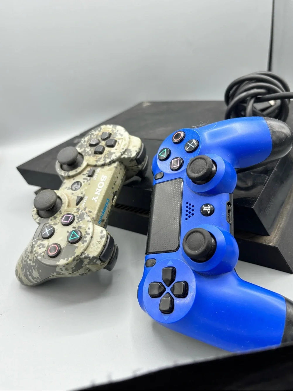 Sony PS4 Slim with Blue and Camouflage DualShock Controllers